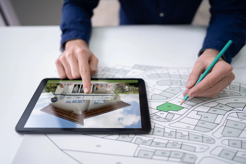 hand holding pencil cadastre map new tablet